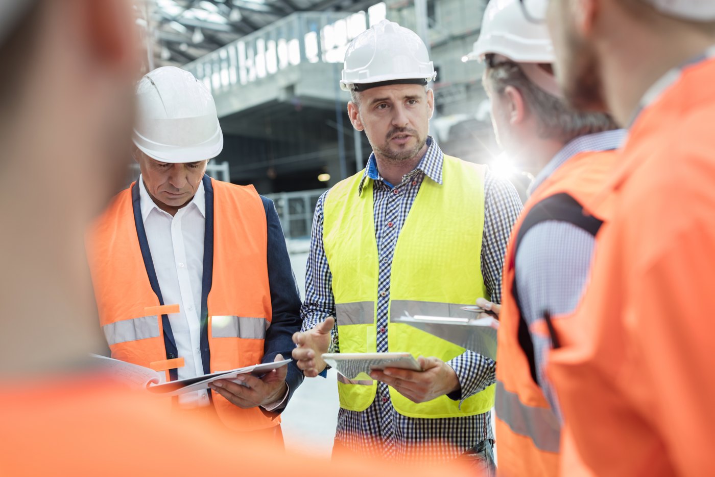 Safety and operations professionals reviewing conditions at an industrial facility